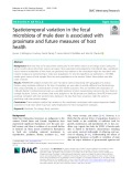 Spatiotemporal variation in the fecal microbiota of mule deer is associated with proximate and future measures of host health